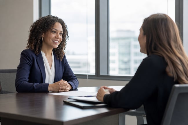 Consultant Interview with Confident Smile in Natural Light Conference Room